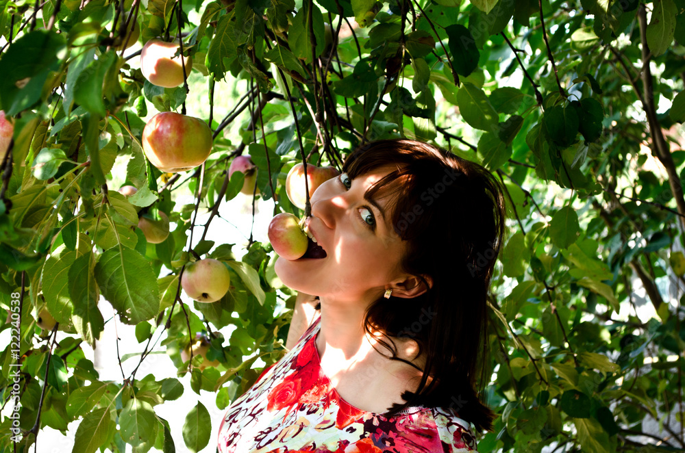 Beautiful girl biting an apple Beautiful girl biting an apple