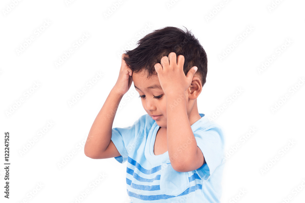 Cute child asian little boy scratching head Cute child asian little boy scratching head