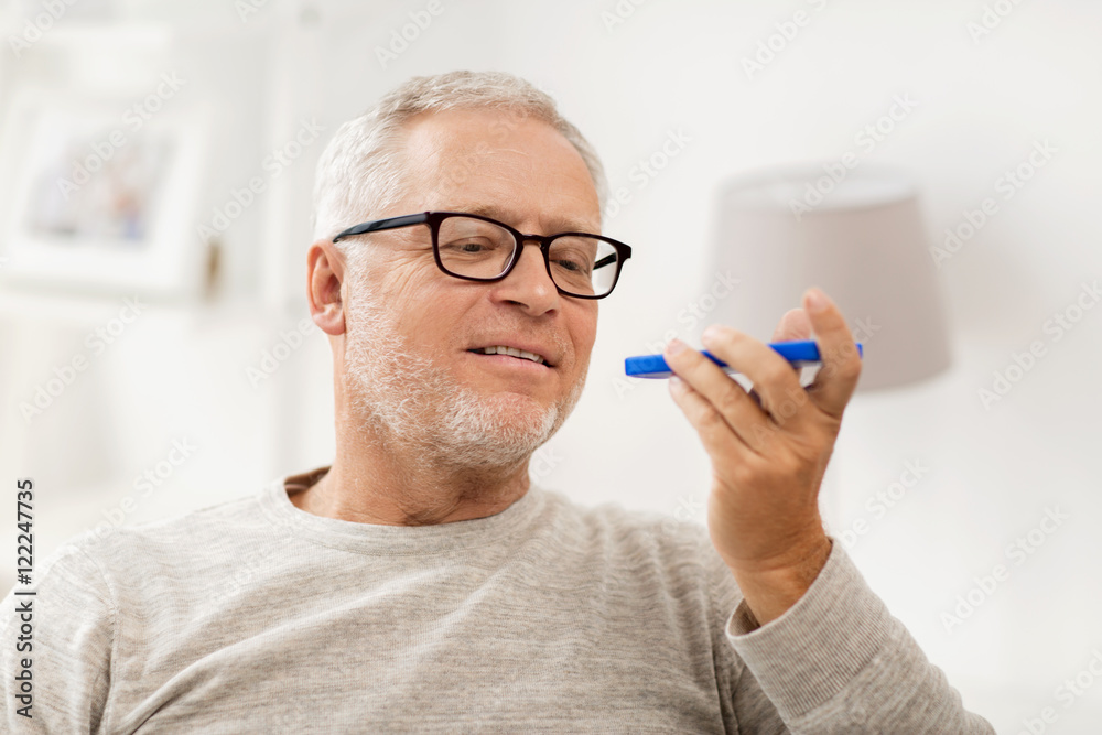 old man using voice command recorder on smartphone old man using voice command recorder on smartphone