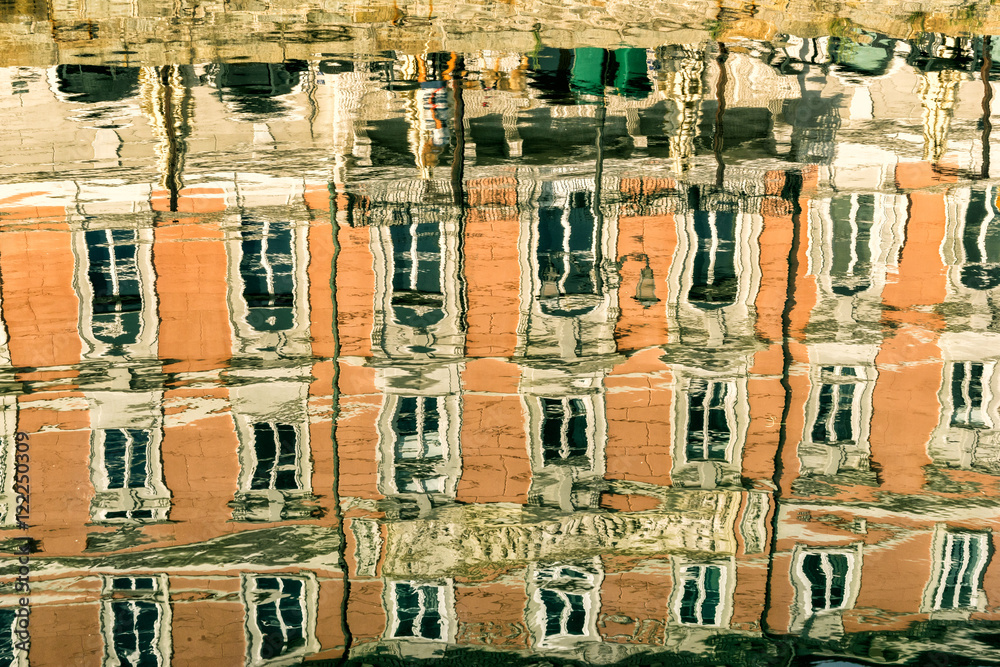 Reflections of property in the Grand Canal in Trieste Italy