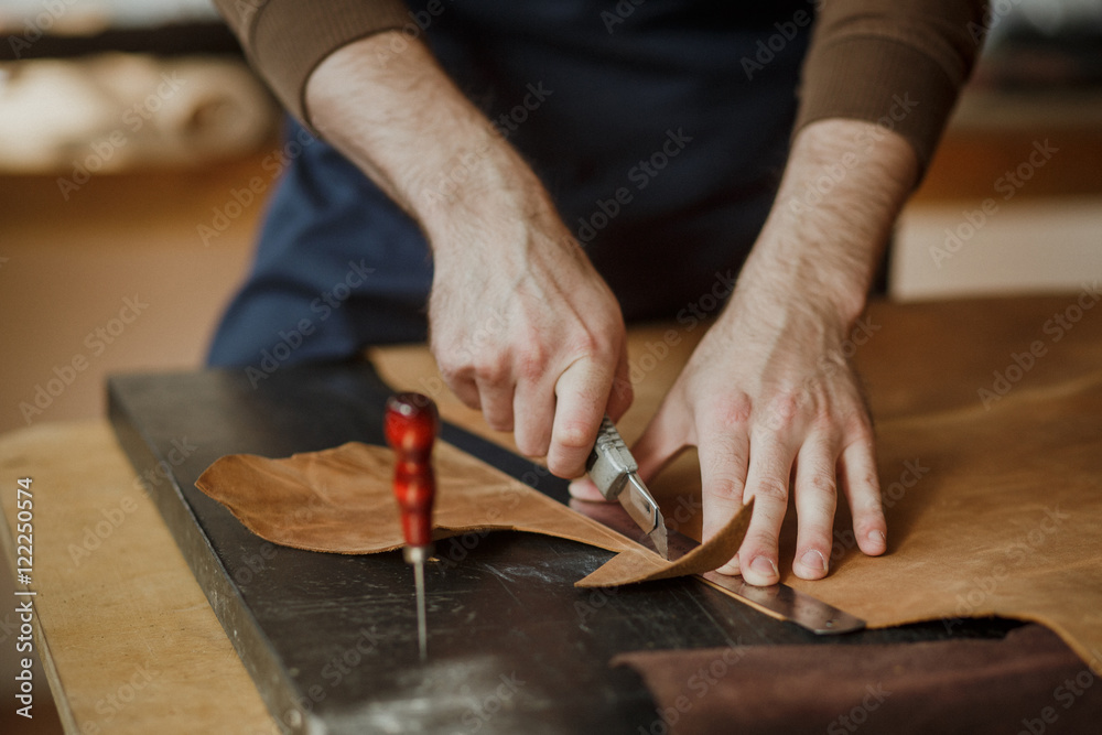 Close-up. Male hand master work with the skin. Small business Close-up. Male hand master work with the skin. Small business