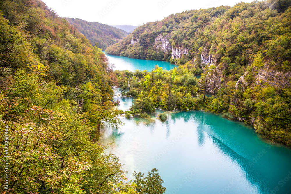 Waterfall in forest. Crystal clear water. wooden walk path, Plitvice lakes, Croatia