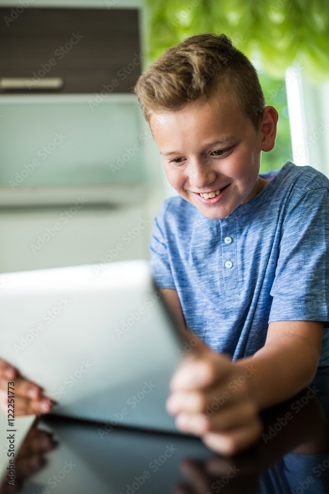 Boy using digital tablet at home Boy using digital tablet at home