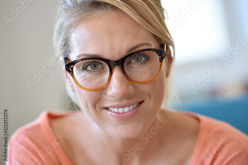 Portrait of blond woman wearing eyeglasses