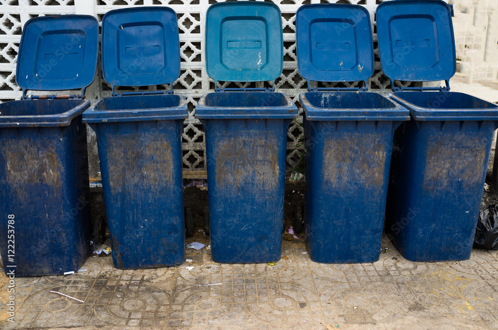 Group industrial trash bins outdoors Group industrial trash bins outdoors