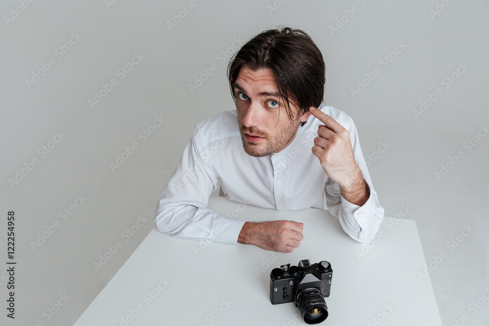 Man pointing at his ear Stock-Foto | Adobe Stock