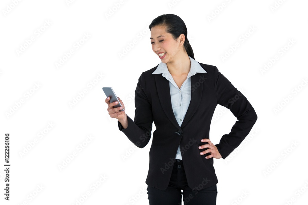 Businesswoman using mobile phone against white background Businesswoman using mobile phone against white background