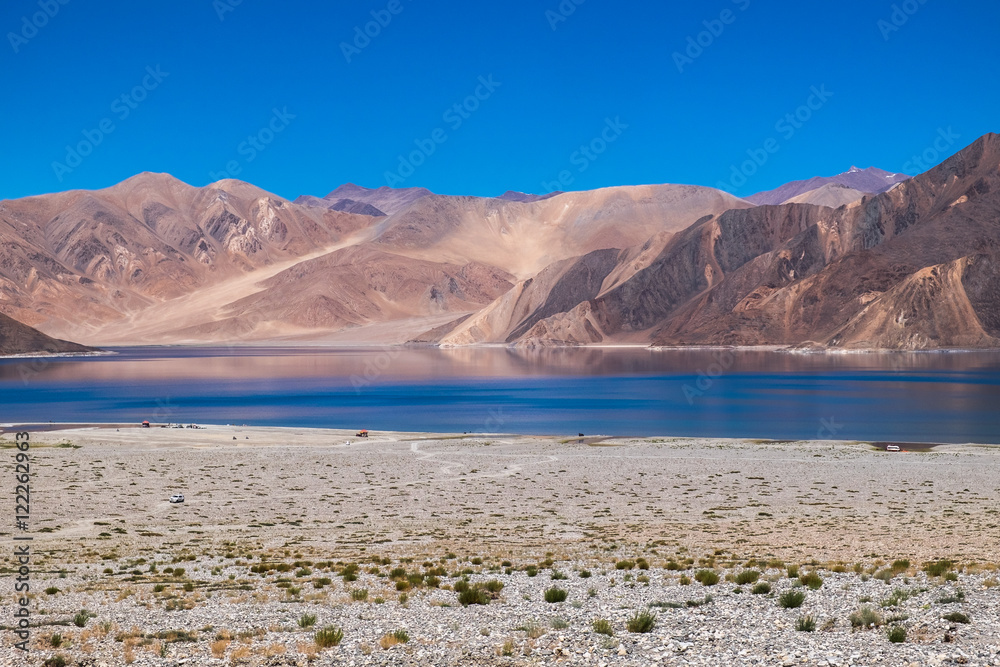 Beautiful Pangong Lake with mountain with blue sky in Leh Ladakh, India.