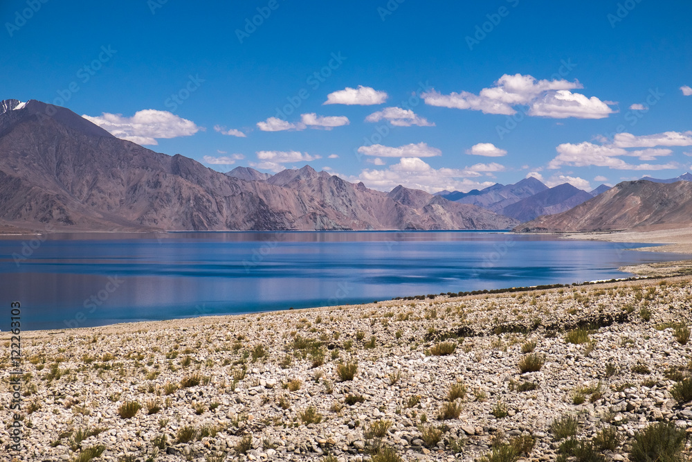 Beautiful Pangong Lake with mountain with blue sky in Leh Ladakh, India.