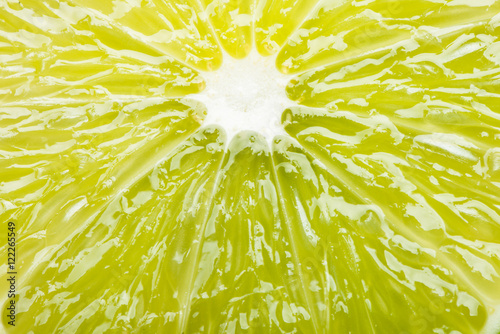 Juicy slice of lime extreme close up filling frame  photo