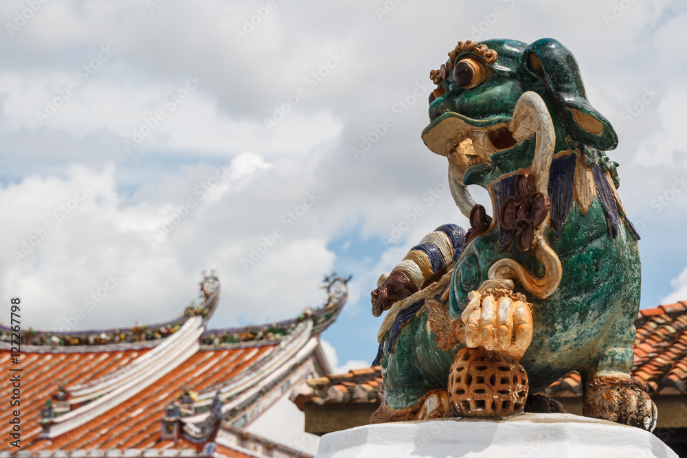 Fototapeta Chinese lion decorating temple in Malacca, Malaysia