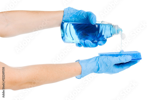 Woman pouring dishwashing detergent on white