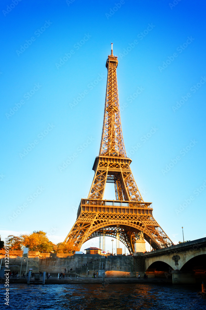 Eiffel Tower over Seine river, Paris, France, retro toned