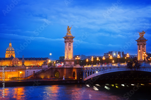 Alexandre III Bridge at night in Paris, France toned
