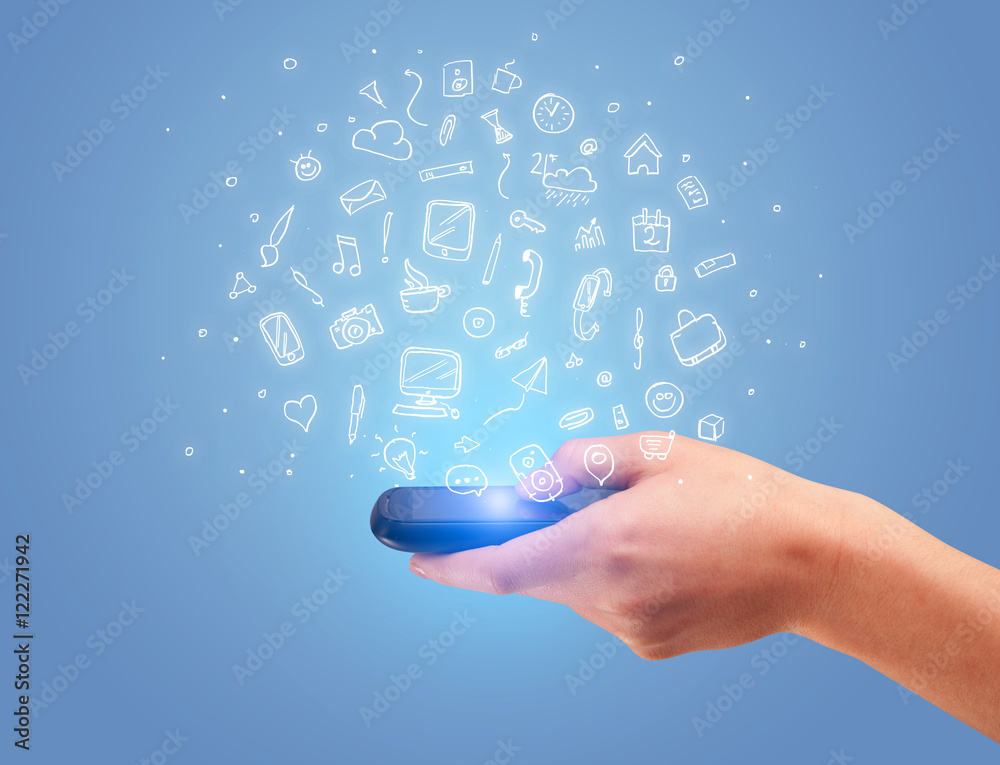 Hand with phone and drawn office icons Hand with phone and drawn office icons