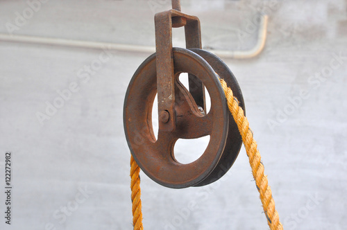 Iron pulley with rope. photo