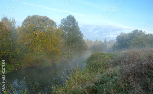 Autumn scene.Small forest river Torgosha in Moscow region,Russia