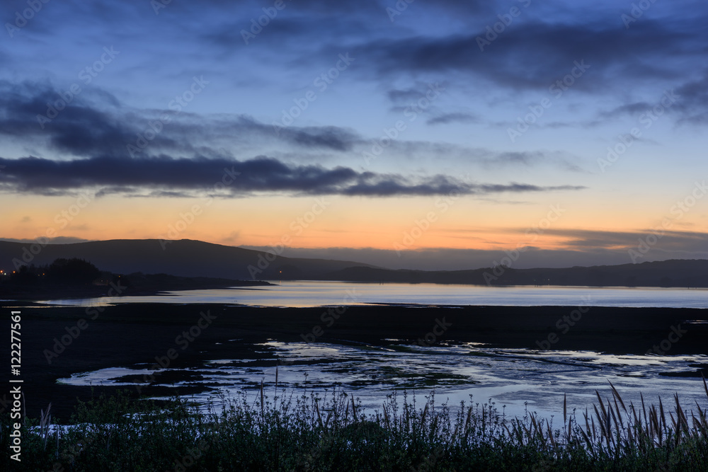 Bodega bay wetlands at dusk under a colorful sky