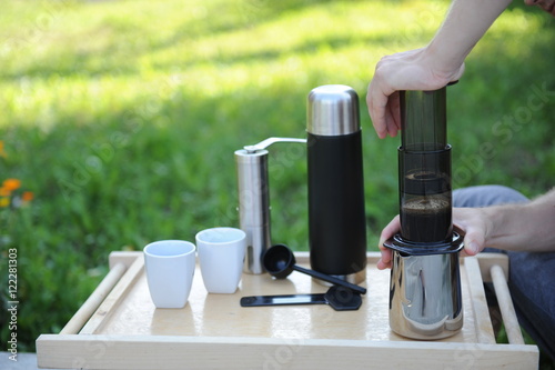 Man making coffee in nature