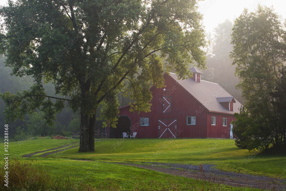 Red barn in early morning fog, Iron Hill, Quebec, Canada