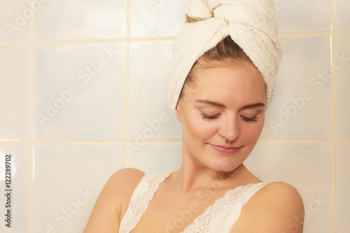woman in towel on her head in bathroom