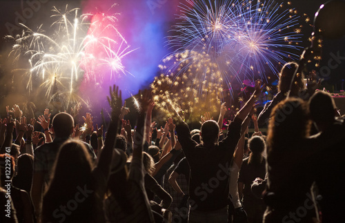 New Year concept - cheering crowd and fireworks © Melinda Nagy