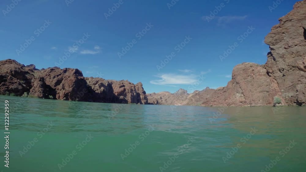 Wide angle POV from a boat cruising through a rocky channel on the Colorado river. Wide angle POV from a boat cruising through a rocky channel on the Colorado river.