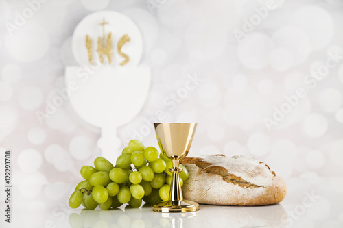 Holy communion a golden chalice  composition isolated on white