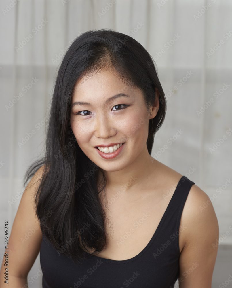 Young Attractive Asian Woman Sitting for Portrait Young Attractive Asian Woman Sitting for Portrait