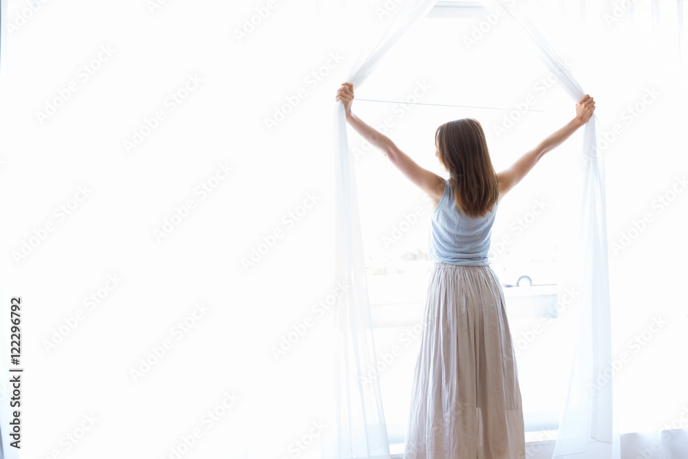 カーテンを開ける女性 Stock Photo | Adobe Stock