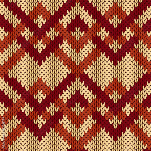 Knitting seamless zigzag pattern in beige and brown