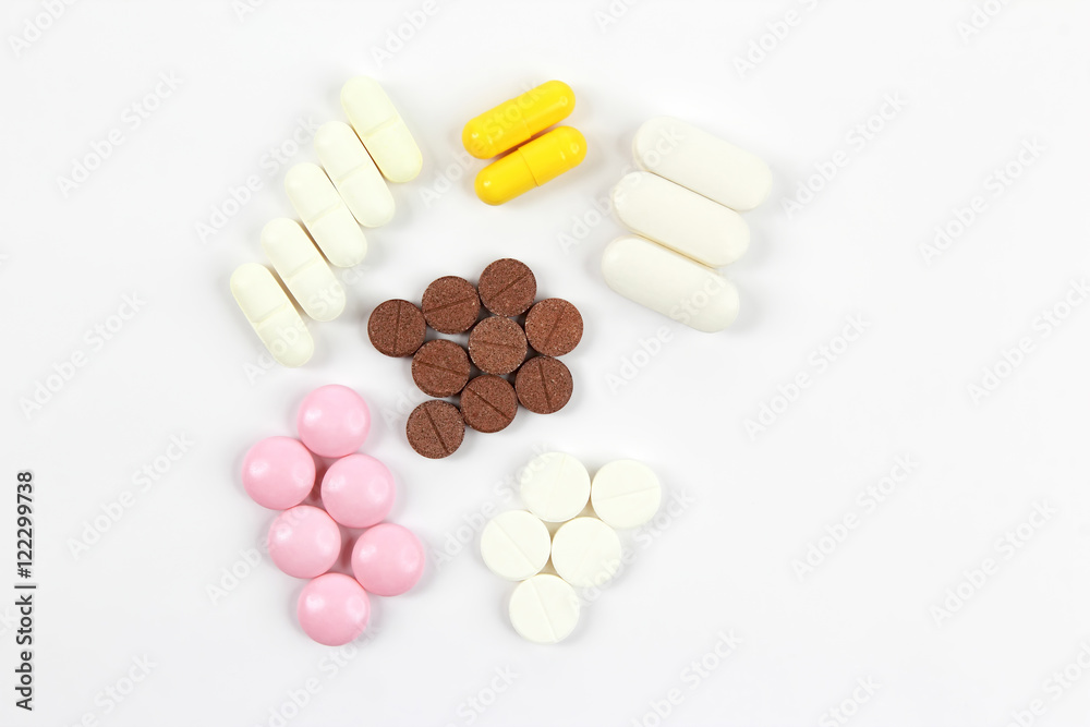 different medicinal pills on white background different medicinal pills on white background