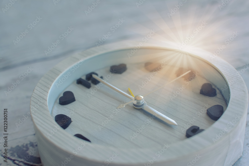 Soft focus heart  alarm clock with shape time indicator and beam light in retro, vintage tone