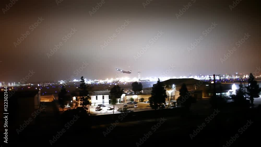 A commercial jet liner takes off from LAX at night.