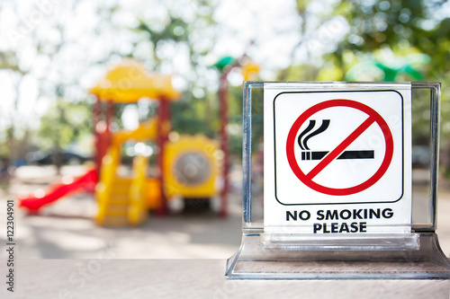 no smoking sign over blurred playground in school background,abstract background for no smoking concept.