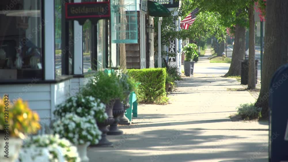 Woman taking a morning walk on main street