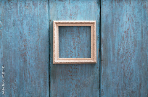 photo frame on blue wooden wall