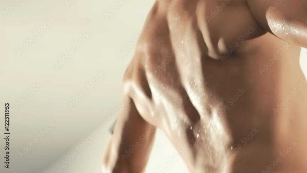Sport muscular athlete pull-ups. Slowly Sport muscular athlete pull-ups. Slowly
