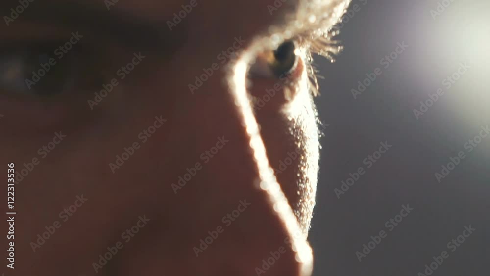 Close up look at camera of sweapy sportsman on grey background. Slowly Close up look at camera of sweapy sportsman on grey background. Slowly