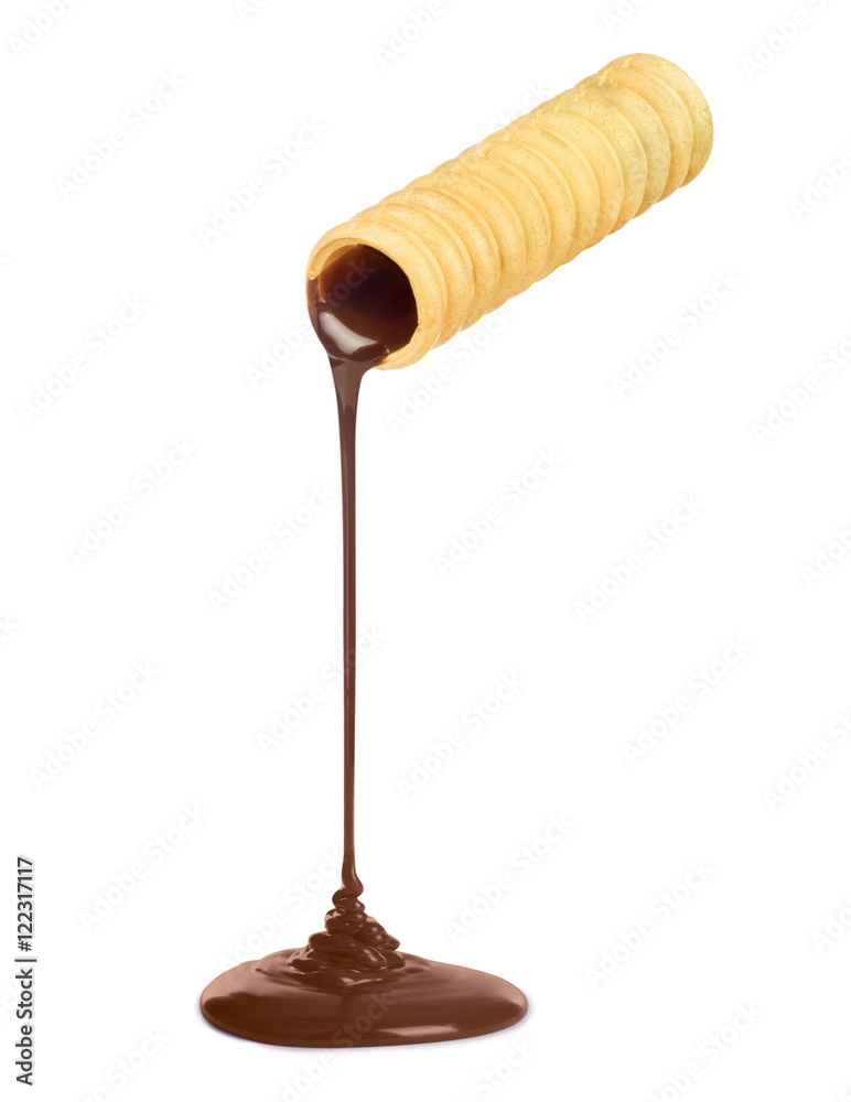Chocolate poured from waffle tubule on white Chocolate poured from waffle tubule on white