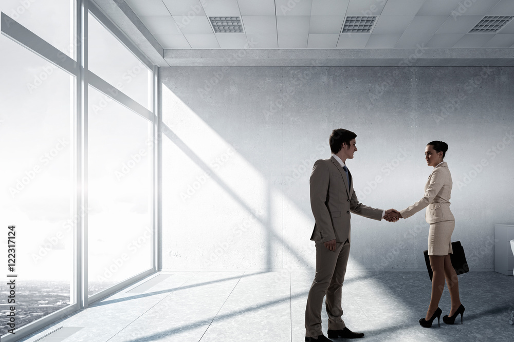 Fototapeta premium Business partners handshake . Mixed media