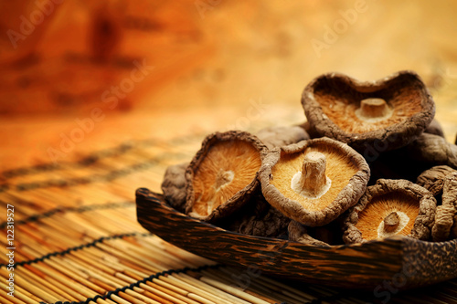 Dried Shiitake Mushroom on mat earth tone background