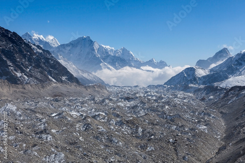 Ngozumpa glacier in Sagarmatha National Park, Himalayas, Nepal. Amazing Himalayan glacier landscape on a clear sunny day. photo