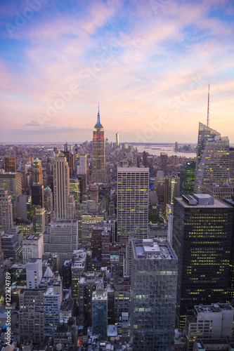 Bright golden pink sunset view of the Midtown Manhattan New York City skyline looking south  © lazyllama