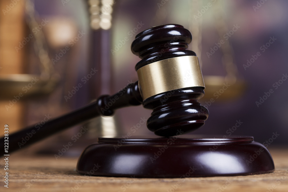 Law theme, mallet of the judge, wooden desk background Law theme, mallet of the judge, wooden desk background
