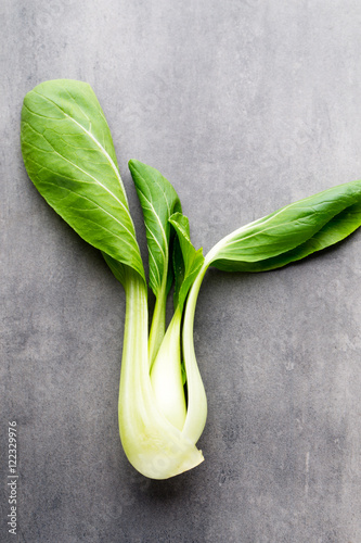 Fresh spinach on the gray background.