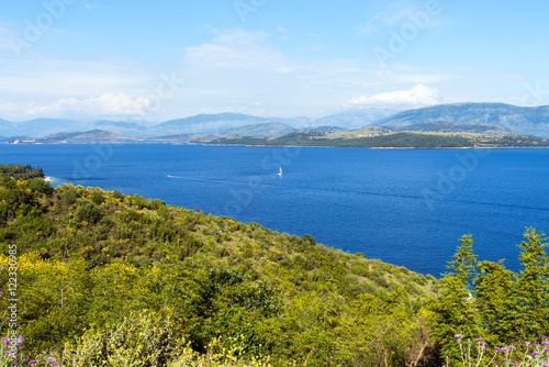 The Straits of Corfu or Corfu Channel. The narrow body of water along the coasts of Albania and Greece. Beautiful view from coast road of Corfu Island. © vivoo