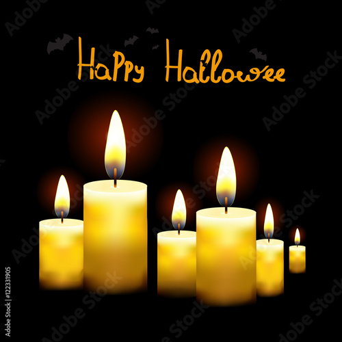 Black background with burning candles.Suitable for Halloween