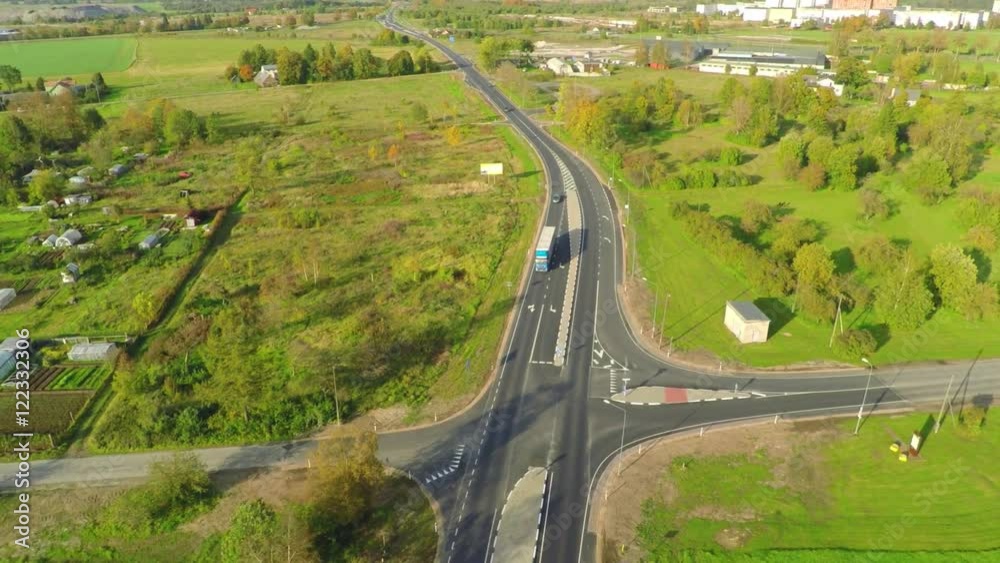 Camera follows white truck, on the road. Aerial footage. Autumn landscape. Camera follows white truck, on the road. Aerial footage. Autumn landscape.