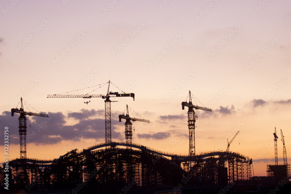 Crane on a construction site at sunrise